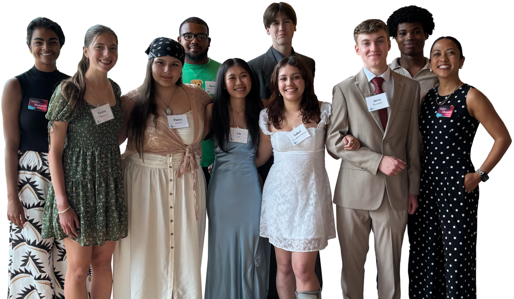 A diverse group of young leaders posing together and smiling at a Grand Rapids Community Foundation event.