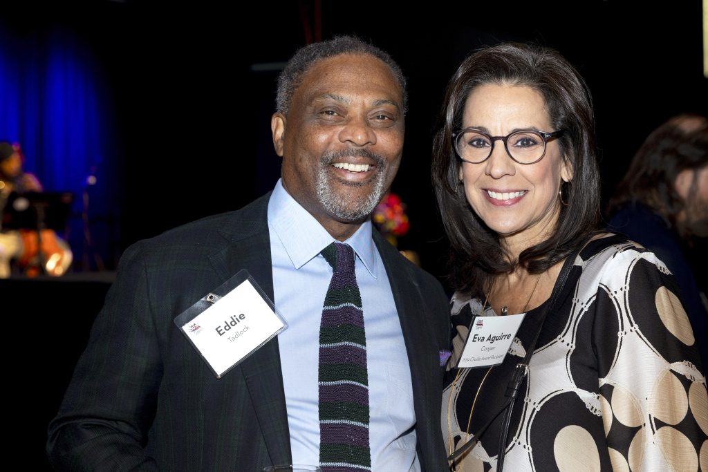 Two Grand Rapids Community Foundation partners smiling together at an event.